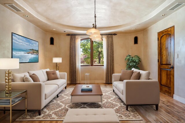 9301 Black Farm Ln NW, Albuquerque, NM 87114 - living area featuring wood finished floors, recessed lighting, and a raised ceiling