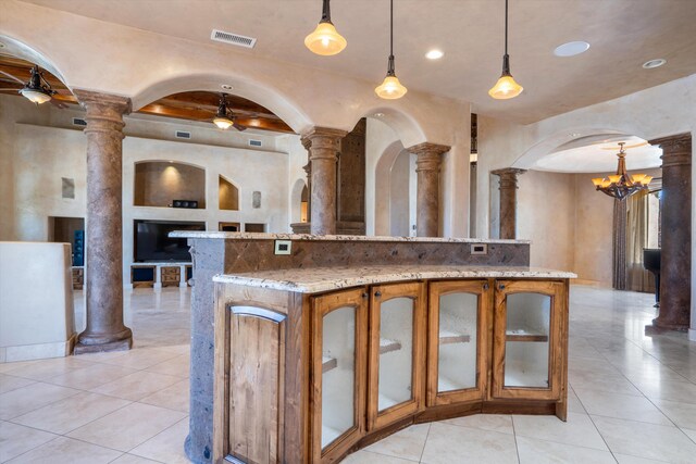 9301 Black Farm Ln NW, Albuquerque, NM 87114 - kitchen featuring a ceiling fan, decorative columns, brown cabinets, light tile patterned floors, and recessed lighting