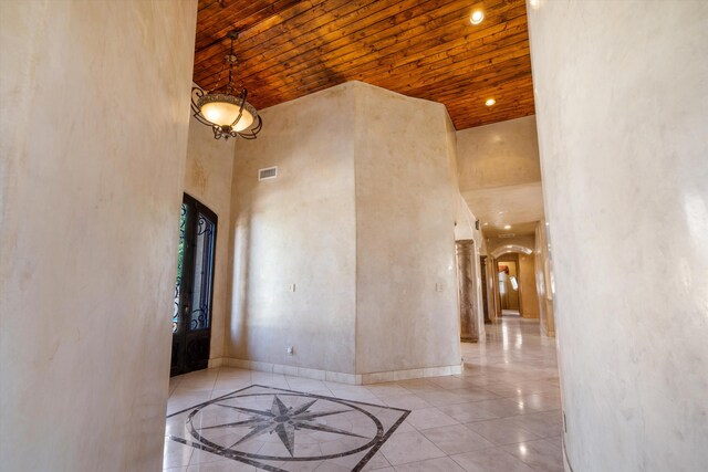 9301 Black Farm Ln NW, Albuquerque, NM 87114 - foyer entrance featuring arched walkways, a towering ceiling, and inlaid floor details
