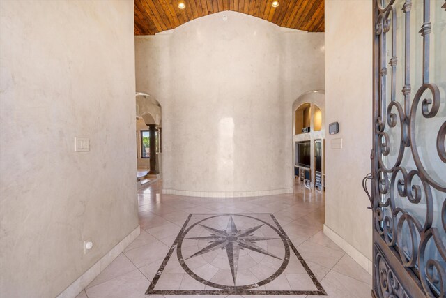 9301 Black Farm Ln NW, Albuquerque, NM 87114 - entrance foyer with wooden ceiling, arched walkways, recessed lighting, high vaulted ceiling, and inlaid floor details
