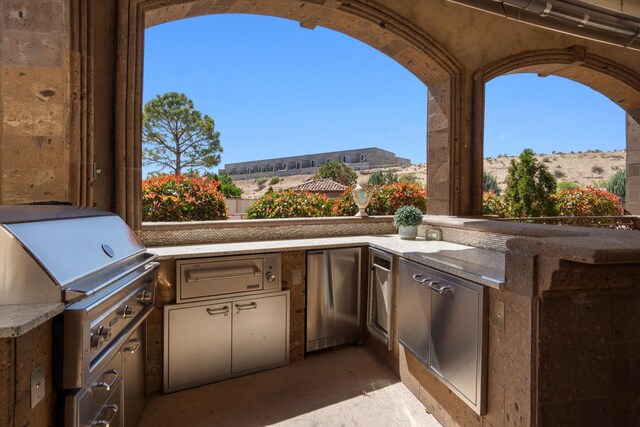 9301 Black Farm Ln NW, Albuquerque, NM 87114 - view of patio featuring exterior kitchen