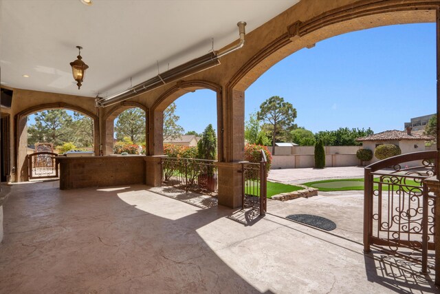 9301 Black Farm Ln NW, Albuquerque, NM 87114 - fenced backyard featuring a gate and a patio area