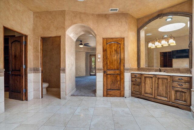 9301 Black Farm Ln NW, Albuquerque, NM 87114 - full bath featuring vanity, ceiling fan, and tile patterned flooring