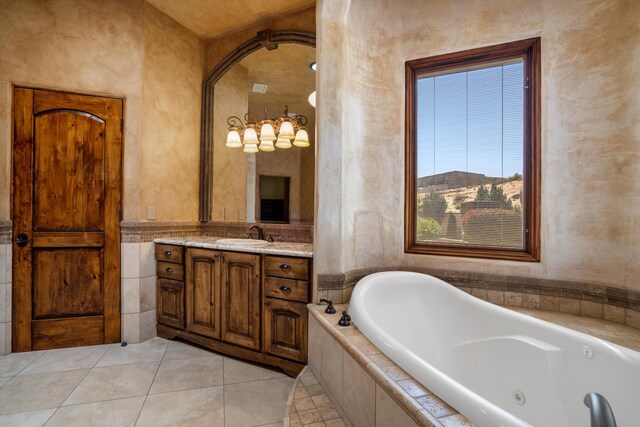 9301 Black Farm Ln NW, Albuquerque, NM 87114 - full bathroom featuring vanity, a tub with jets, and tile patterned floors