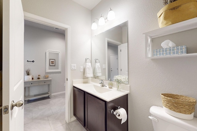 1854 Valle Vista Rd NW, Los Lunas, NM 87031 - bathroom with vanity, toilet, and tile patterned flooring