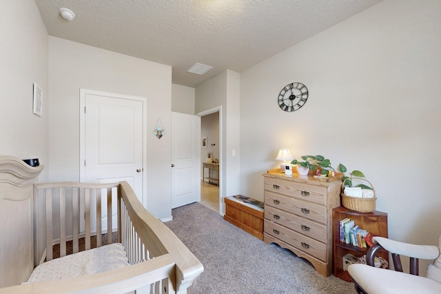 1854 Valle Vista Rd NW, Los Lunas, NM 87031 - bedroom featuring carpet floors and a textured ceiling