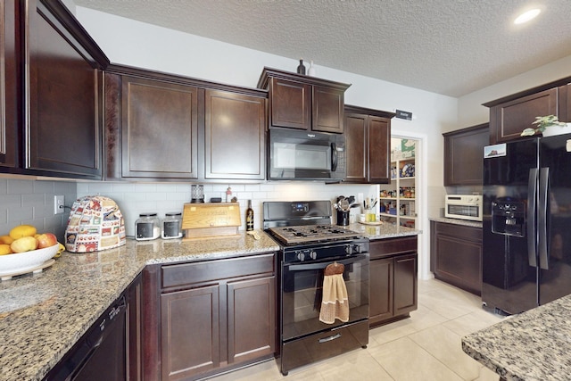 1854 Valle Vista Rd NW, Los Lunas, NM 87031 - kitchen featuring black appliances, decorative backsplash, light stone countertops, a textured ceiling, and dark brown cabinets