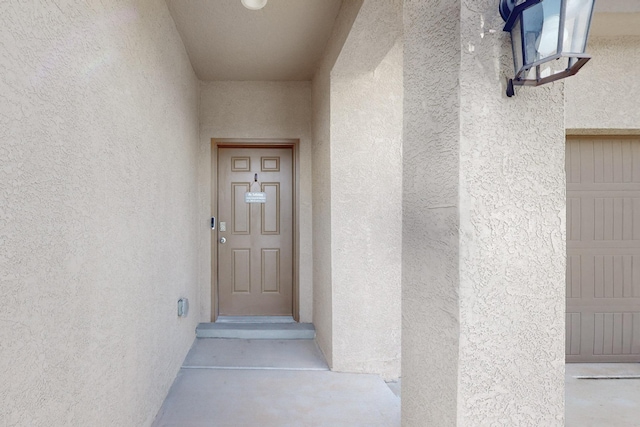 1854 Valle Vista Rd NW, Los Lunas, NM 87031 - view of exterior entry featuring stucco siding