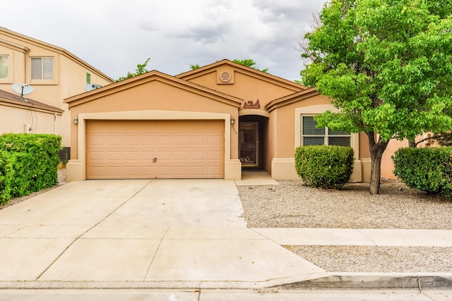 7113 Avignon Ct NW, Albuquerque, NM 87114 - view of front of house featuring stucco siding, driveway, and a garage