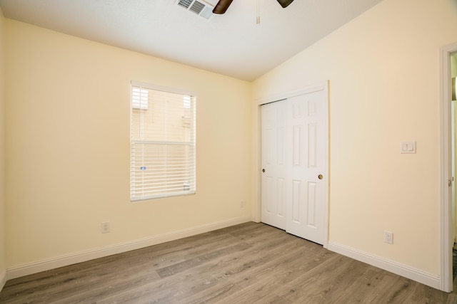7113 Avignon Ct NW, Albuquerque, NM 87114 - unfurnished bedroom with wood finished floors, baseboards, lofted ceiling, a closet, and a ceiling fan