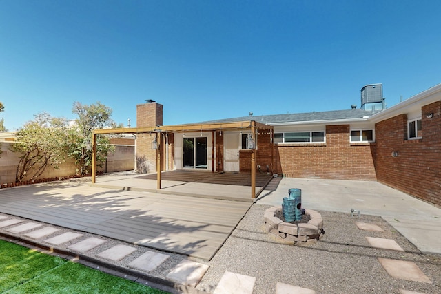 2912 Alcazar St NE, Albuquerque, NM 87110 - back of house featuring a patio, a fenced backyard, brick siding, a chimney, and cooling unit
