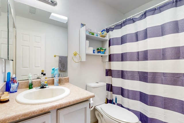 402 Calle Don Santiago NE, Los Lunas, NM 87031 - bathroom featuring vanity, toilet, and a shower with shower curtain