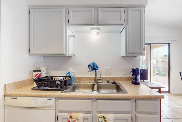 402 Calle Don Santiago NE, Los Lunas, NM 87031 - kitchen with white dishwasher, a sink, light tile patterned floors, and light countertops