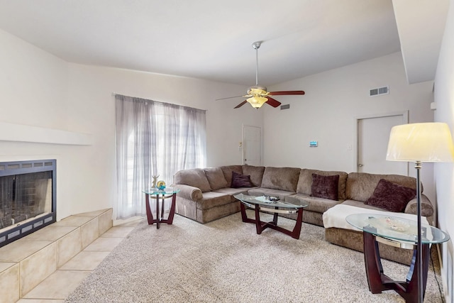 402 Calle Don Santiago NE, Los Lunas, NM 87031 - living area with a ceiling fan, a tiled fireplace, and carpet