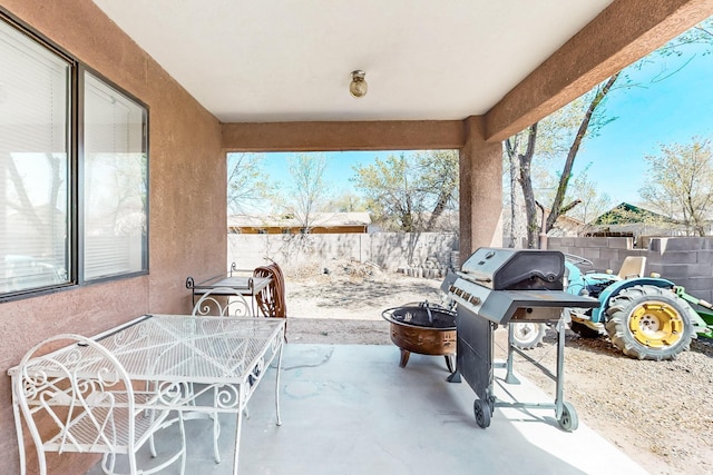 402 Calle Don Santiago NE, Los Lunas, NM 87031 - fenced backyard featuring a patio area, a grill, and outdoor dining space