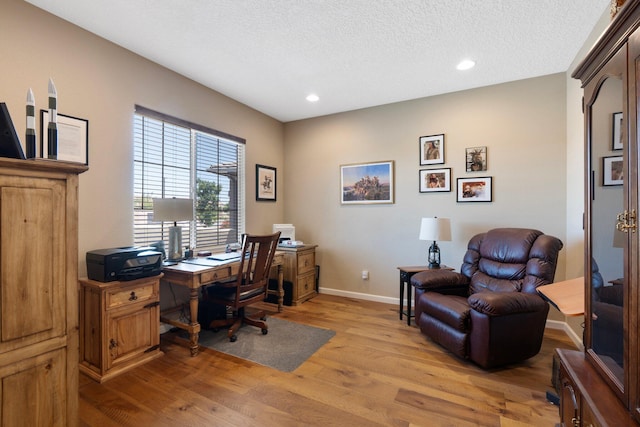 6413 Kings Cyn NE, Rio Rancho, NM 87144 - office area featuring light wood-style floors, baseboards, recessed lighting, and a textured ceiling