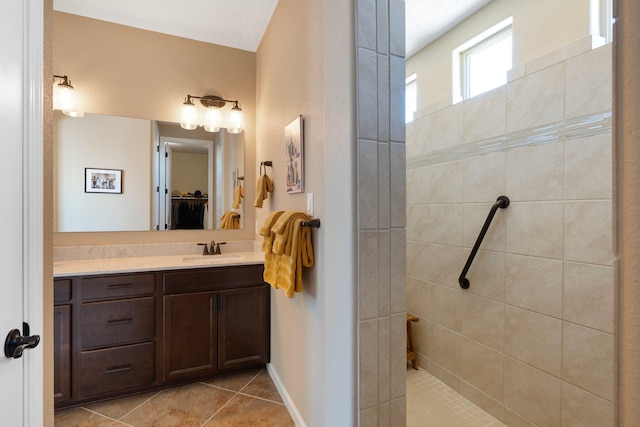 6413 Kings Cyn NE, Rio Rancho, NM 87144 - full bathroom with vanity, a walk in closet, walk in shower, and tile patterned flooring