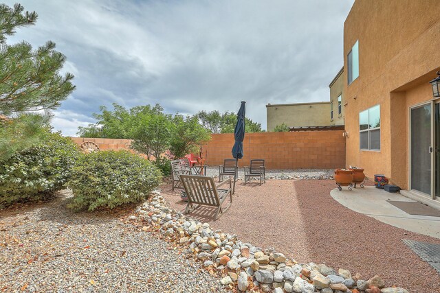 1921 Cortina Loop SE, Rio Rancho, NM 87124 - fenced backyard with a patio area