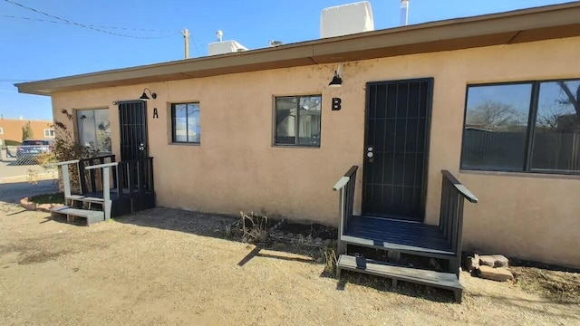 820 Apache Ave NW, Albuquerque, NM 87102 - entrance to property with stucco siding