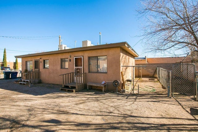 820 Apache Ave NW, Albuquerque, NM 87102 - back of house with stucco siding