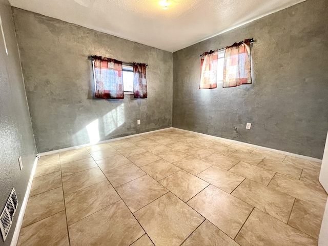 820 Apache Ave NW, Albuquerque, NM 87102 - empty room with a textured ceiling