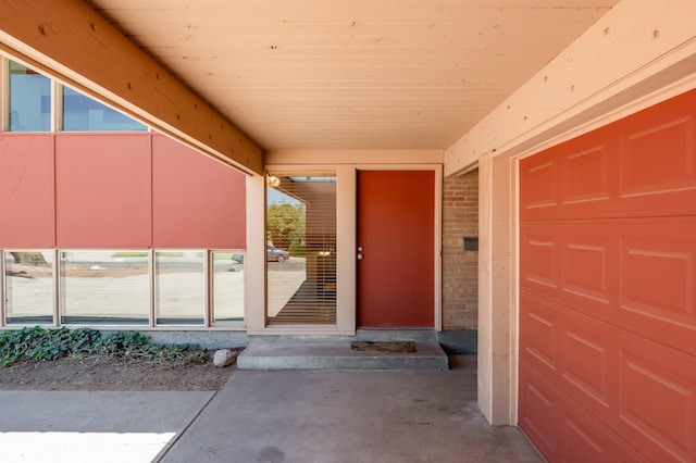 4818 Royene Ave NE, Albuquerque, NM 87110 - doorway to property with a garage and brick siding