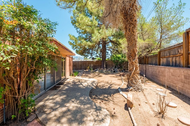4818 Royene Ave NE, Albuquerque, NM 87110 - fenced backyard featuring a patio area