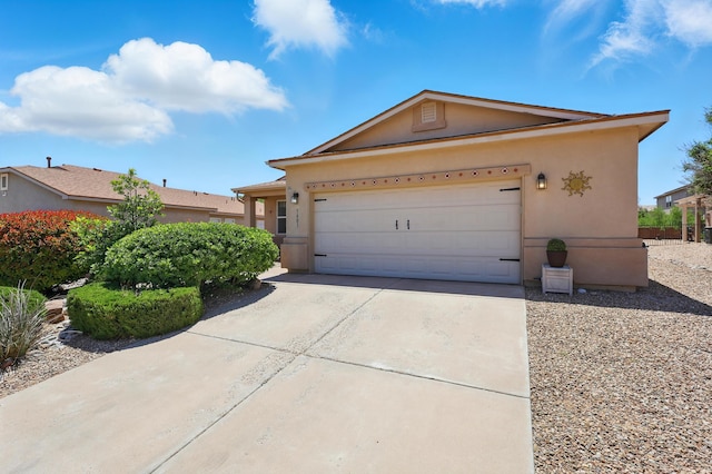 3401 Sun Mesa St SW, Los Lunas, NM 87031 - single story home with stucco siding, concrete driveway, and an attached garage