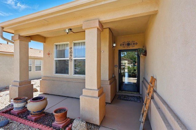 3401 Sun Mesa St SW, Los Lunas, NM 87031 - view of exterior entry featuring stucco siding