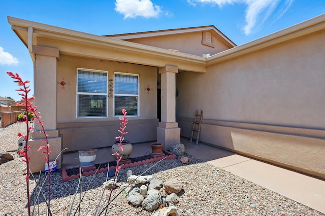 3401 Sun Mesa St SW, Los Lunas, NM 87031 - doorway to property featuring stucco siding