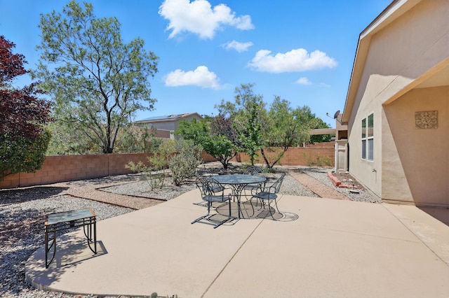 3401 Sun Mesa St SW, Los Lunas, NM 87031 - fenced backyard with a patio area and outdoor dining area