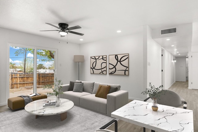 7525 Gill St NE, Albuquerque, NM 87109 - living area with light wood-style floors, a ceiling fan, recessed lighting, and baseboards