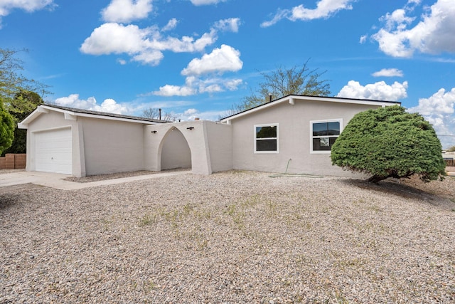 7525 Gill St NE, Albuquerque, NM 87109 - view of front of property featuring stucco siding, an attached garage, and concrete driveway