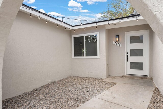 7525 Gill St NE, Albuquerque, NM 87109 - property entrance with stucco siding