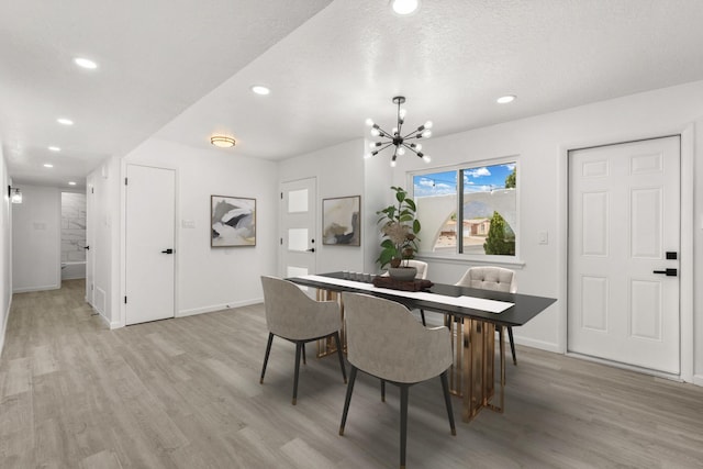 7525 Gill St NE, Albuquerque, NM 87109 - dining room featuring light wood-type flooring, recessed lighting, a chandelier, and baseboards
