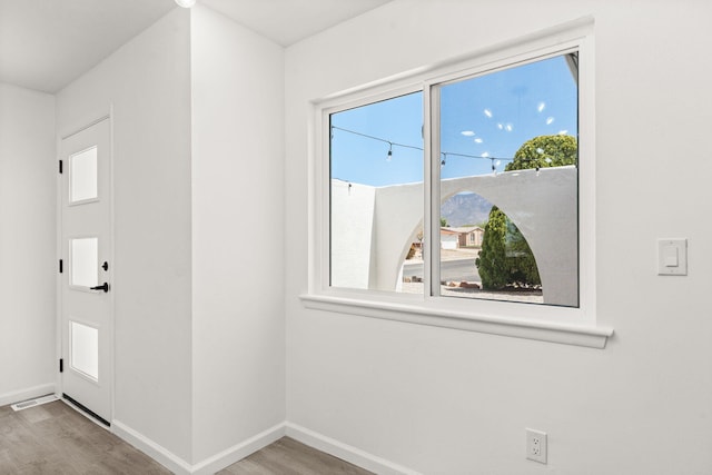 7525 Gill St NE, Albuquerque, NM 87109 - unfurnished room with wood finished floors and baseboards