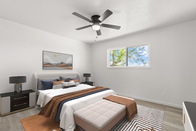7525 Gill St NE, Albuquerque, NM 87109 - bedroom with light wood-type flooring, baseboards, and ceiling fan