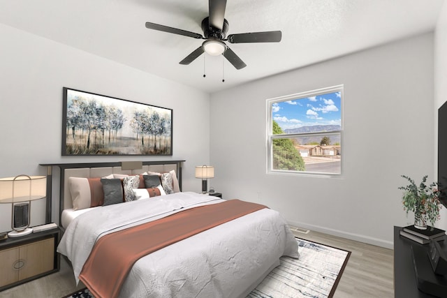 7525 Gill St NE, Albuquerque, NM 87109 - bedroom featuring light wood-style floors, baseboards, and a ceiling fan