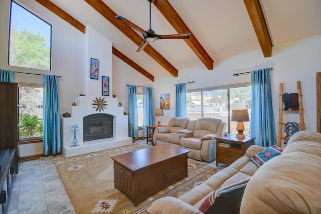 2865 Tramway Cir NE, Albuquerque, NM 87122 - living area featuring high vaulted ceiling, beamed ceiling, a glass covered fireplace, a ceiling fan, and plenty of natural light