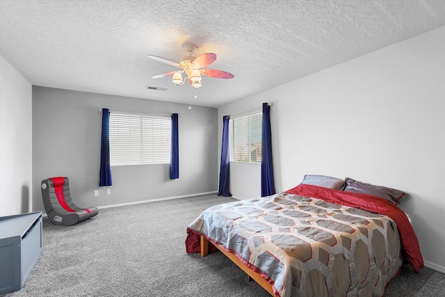 8935 Balsam Glade Rd NW, Albuquerque, NM 87114 - carpeted bedroom featuring ceiling fan, baseboards, and a textured ceiling