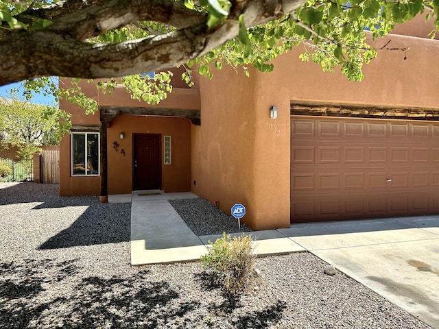 3032 Cochiti St NE, Rio Rancho, NM 87144 - view of front facade featuring stucco siding