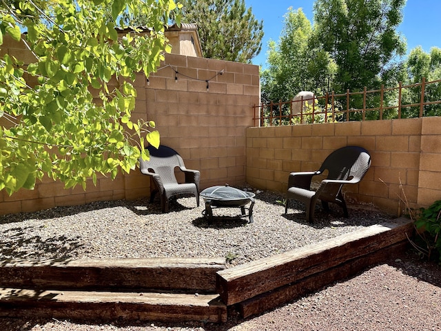 3032 Cochiti St NE, Rio Rancho, NM 87144 - view of patio / terrace featuring an outdoor fire pit