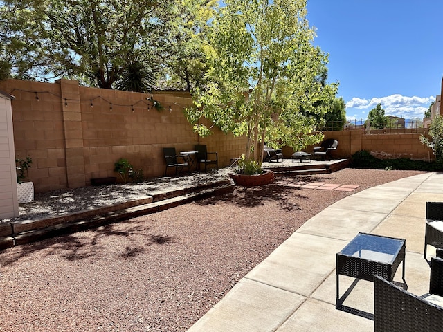 3032 Cochiti St NE, Rio Rancho, NM 87144 - fenced yard with a patio area