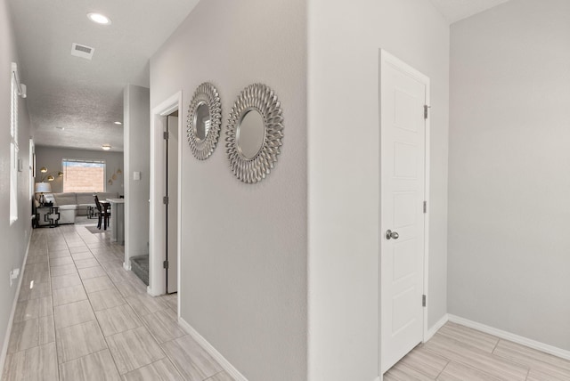 684 Turmalina Dr SE, Rio Rancho, NM 87124 - hall featuring baseboards and recessed lighting