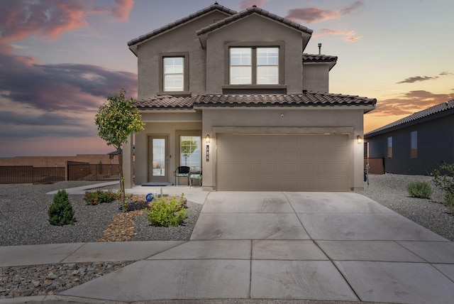 684 Turmalina Dr SE, Rio Rancho, NM 87124 - mediterranean / spanish house with driveway, stucco siding, an attached garage, and a tile roof