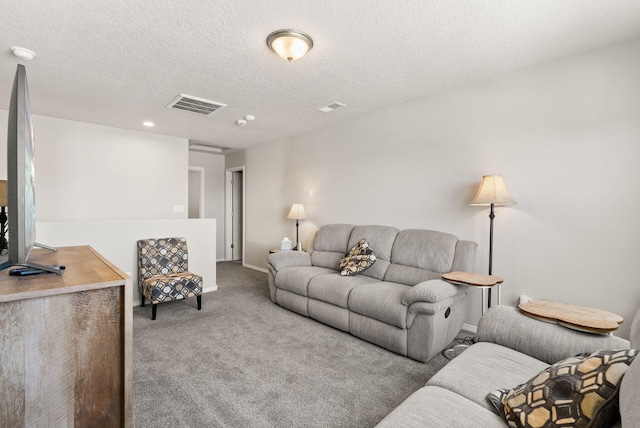 684 Turmalina Dr SE, Rio Rancho, NM 87124 - carpeted living room featuring a textured ceiling, recessed lighting, and baseboards