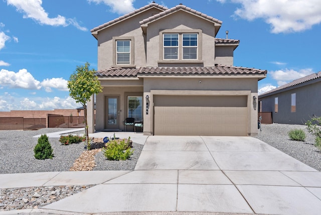 684 Turmalina Dr SE, Rio Rancho, NM 87124 - mediterranean / spanish home with a garage, stucco siding, concrete driveway, and a tiled roof