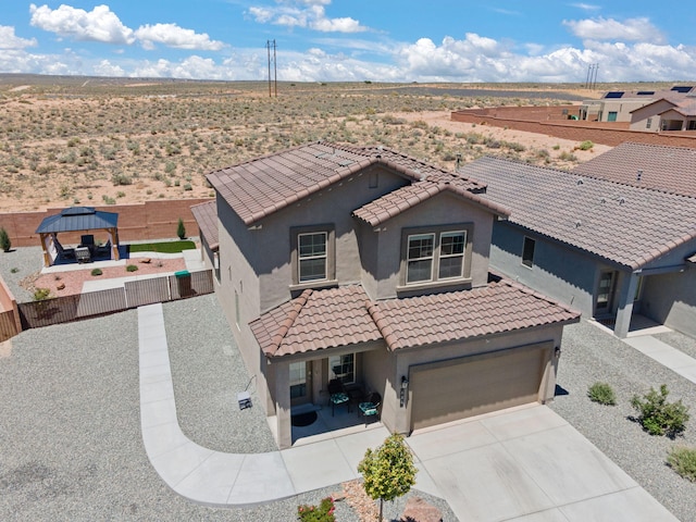 684 Turmalina Dr SE, Rio Rancho, NM 87124 - view of front of property featuring stucco siding, a gazebo, a tiled roof, and concrete driveway