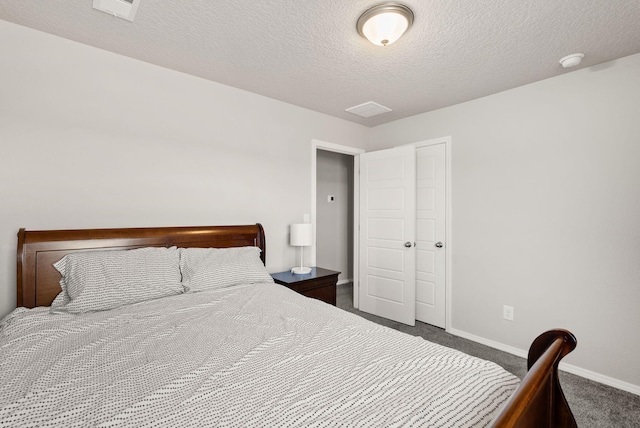 684 Turmalina Dr SE, Rio Rancho, NM 87124 - bedroom featuring dark colored carpet, baseboards, and a textured ceiling