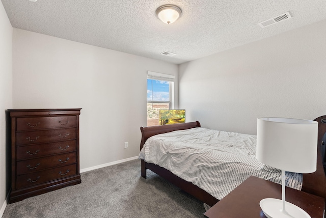 684 Turmalina Dr SE, Rio Rancho, NM 87124 - bedroom featuring carpet flooring, a textured ceiling, and baseboards